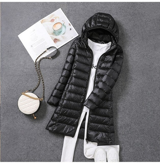Women's longline quilted puffer coat with hood and front zipper