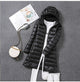 Women's longline quilted puffer coat with hood and front zipper