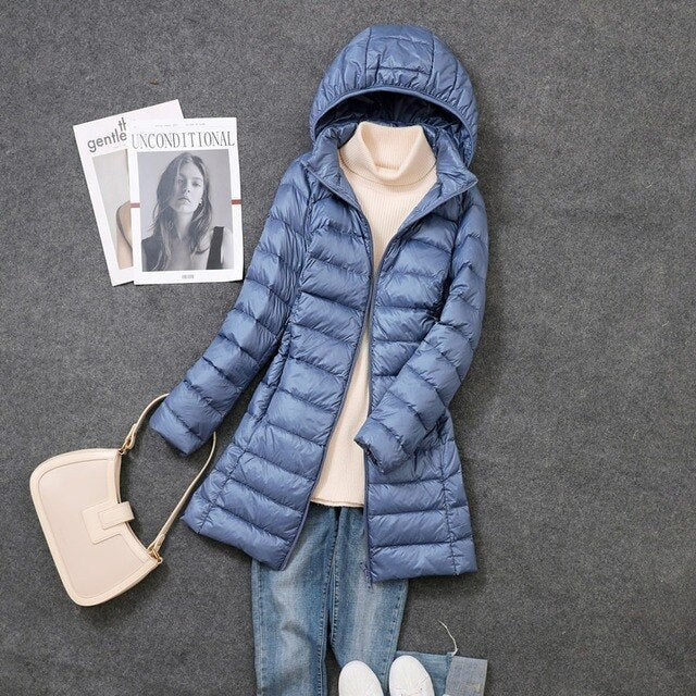 Women's longline quilted puffer coat with hood and front zipper