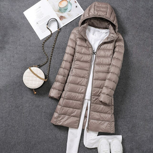 Women's longline quilted puffer coat with hood and front zipper