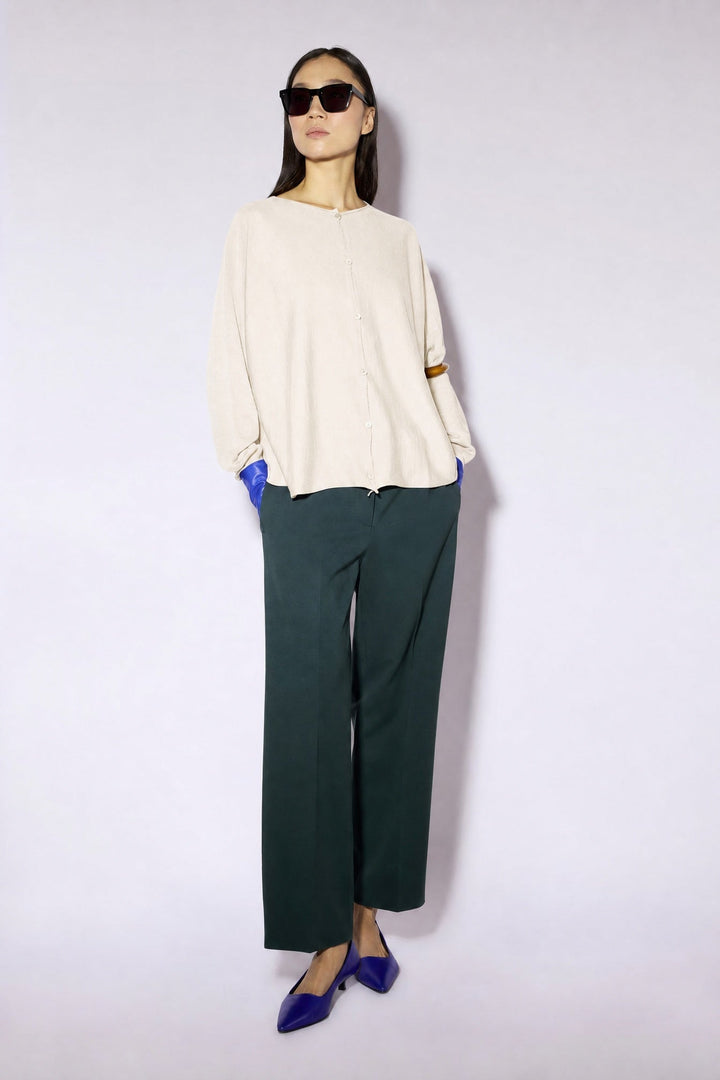 Women's long-sleeve button cardigan with a round neckline and hip-length hem