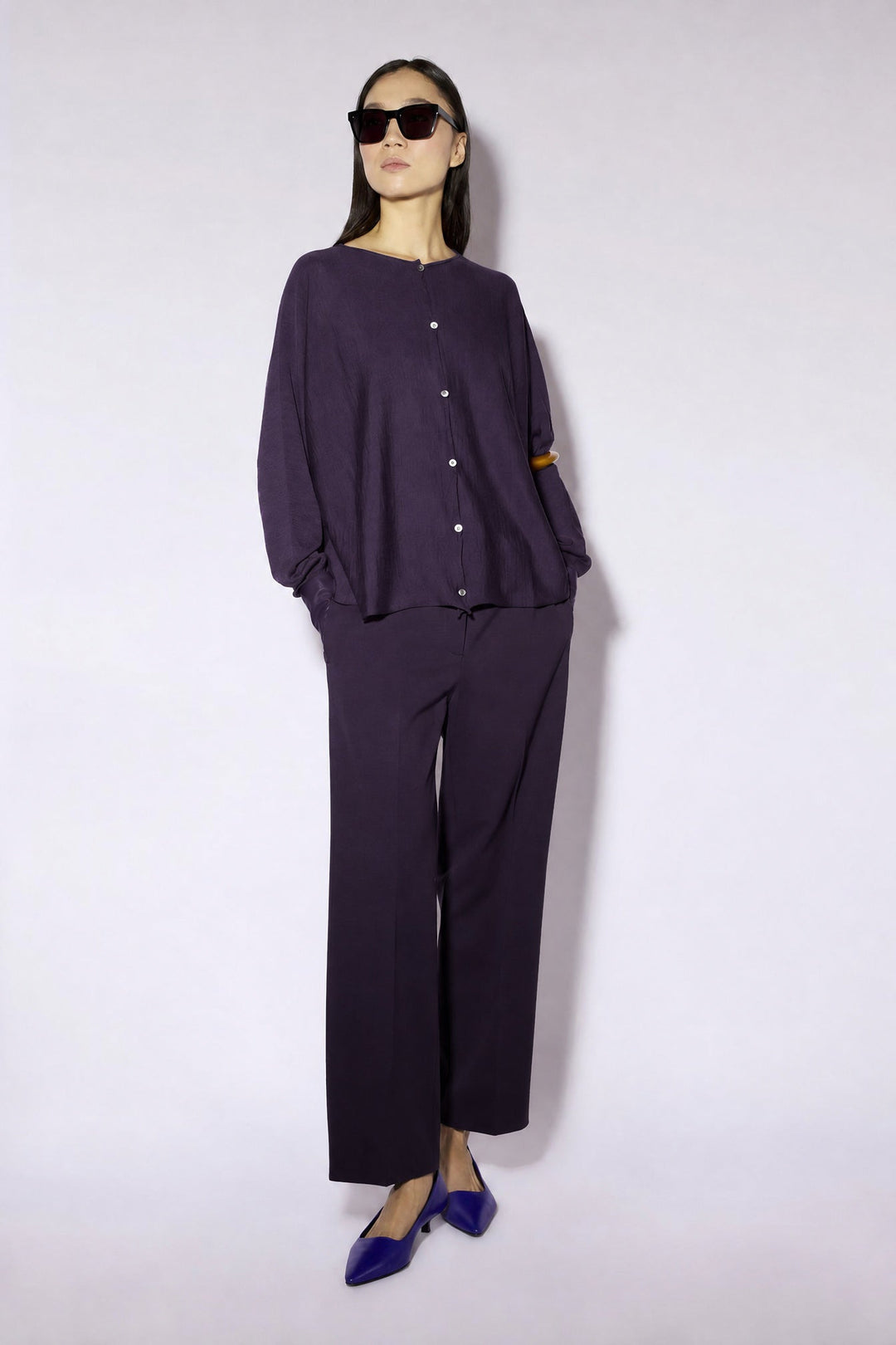Women's long-sleeve button cardigan with a round neckline and hip-length hem