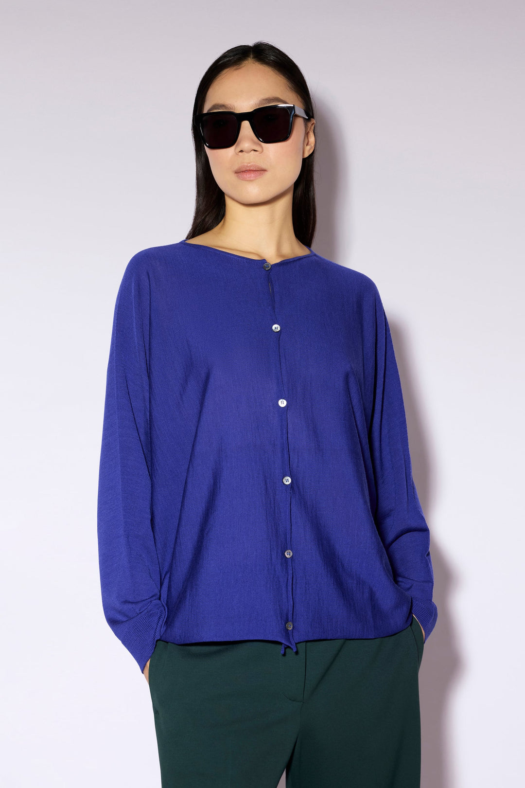 Women's long-sleeve button cardigan with a round neckline and hip-length hem