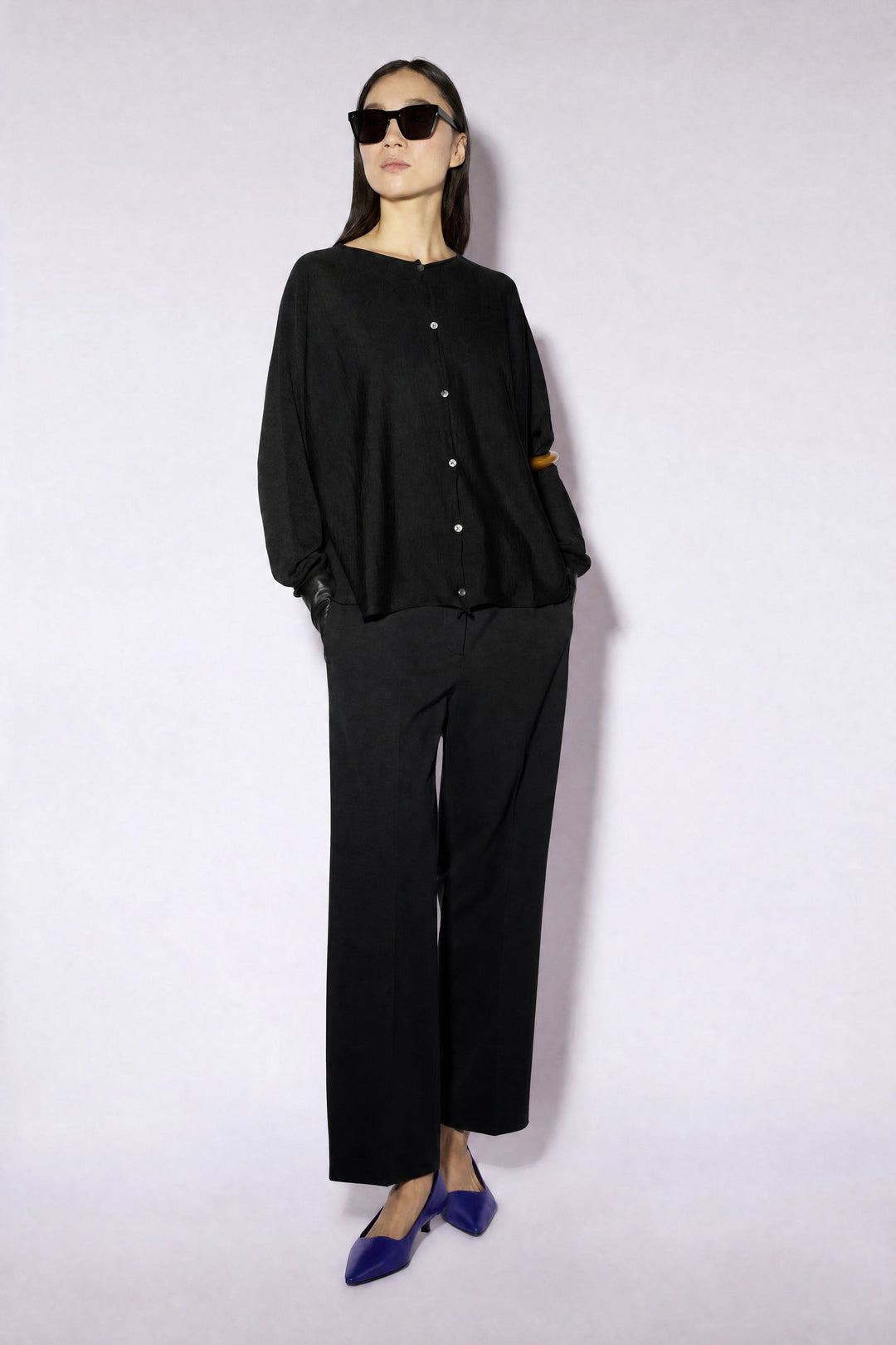 Women's long-sleeve button cardigan with a round neckline and hip-length hem