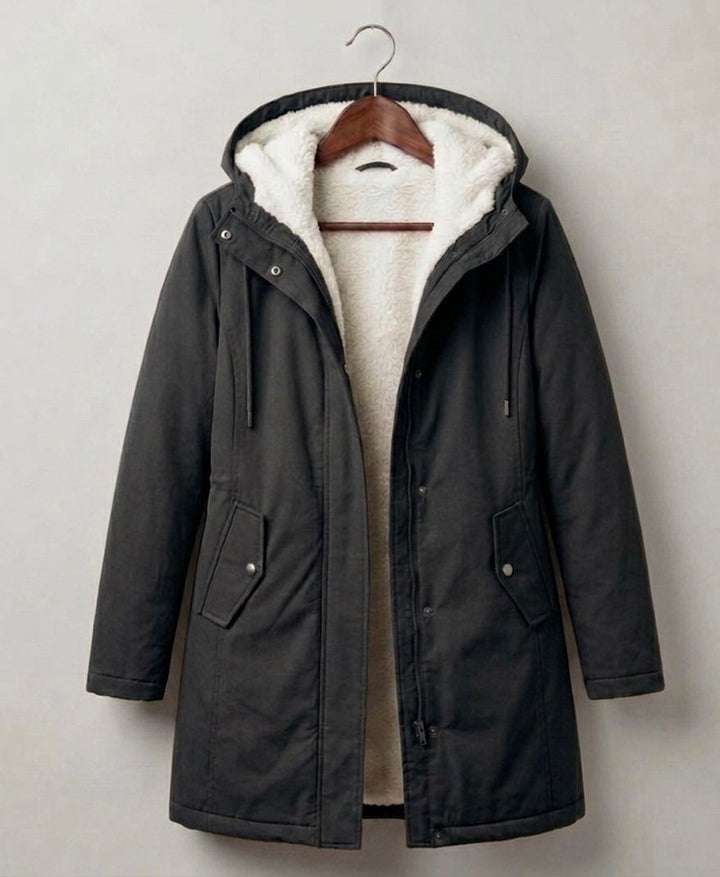 Women's long hooded parka with lined interior and flap pockets