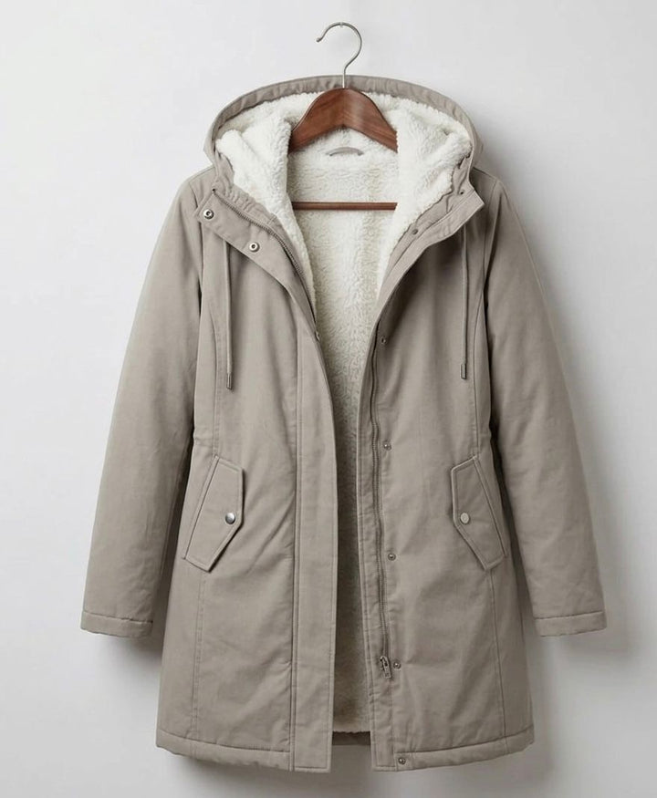 Women's long hooded parka with lined interior and flap pockets