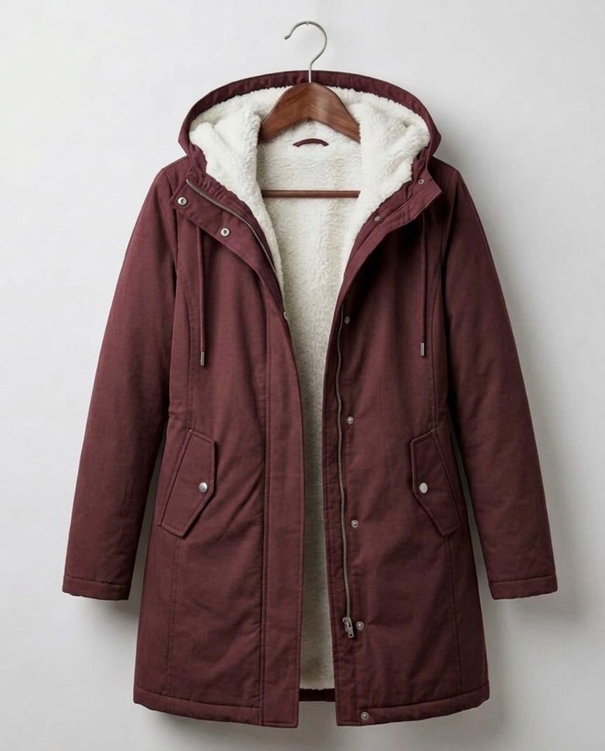Women's long hooded parka with lined interior and flap pockets