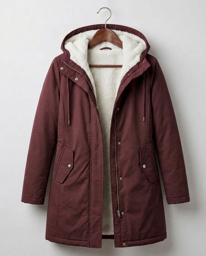 Women's long hooded parka with lined interior and flap pockets