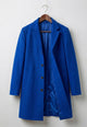 Women's tailored button front coat with notched lapels and angled pockets