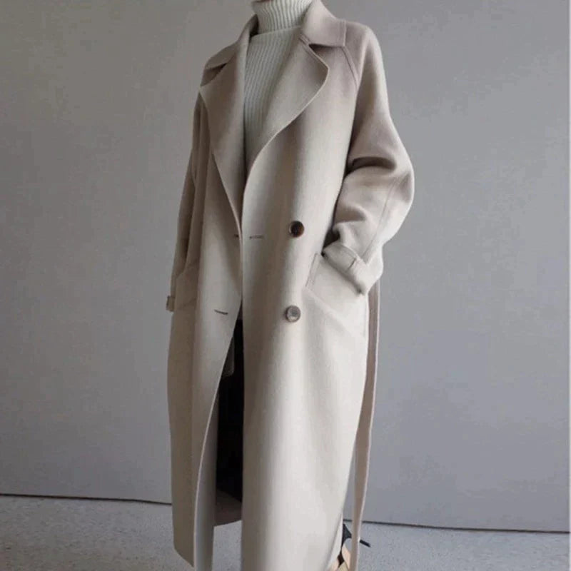 Women's longline button-front coat with notched lapels and side pockets