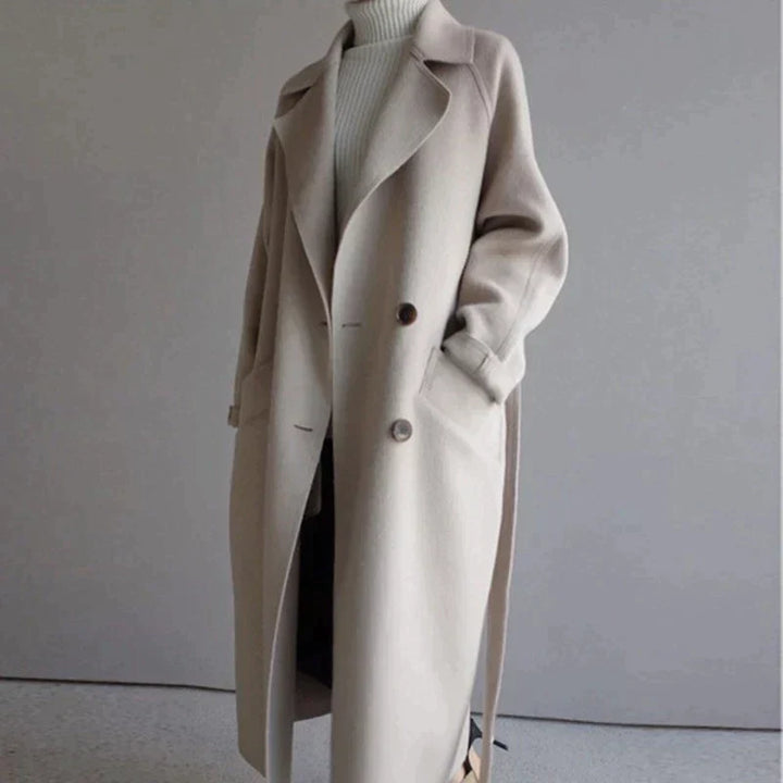 Women's longline button-front coat with notched lapels and side pockets