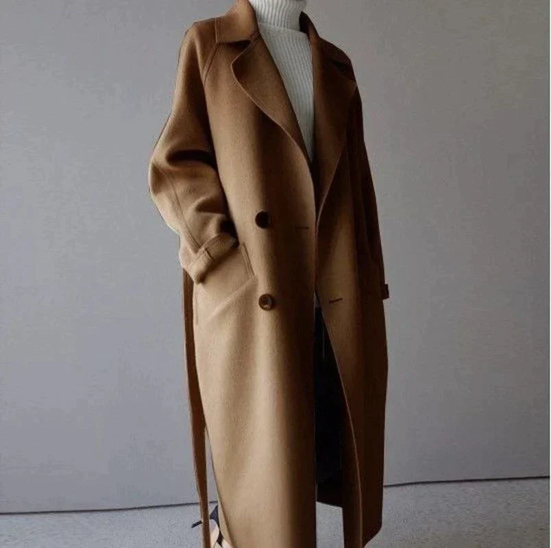 Women's longline button-front coat with notched lapels and side pockets