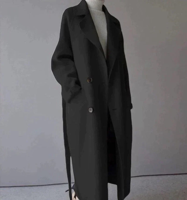Women's longline button-front coat with notched lapels and side pockets