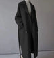 Women's longline button-front coat with notched lapels and side pockets