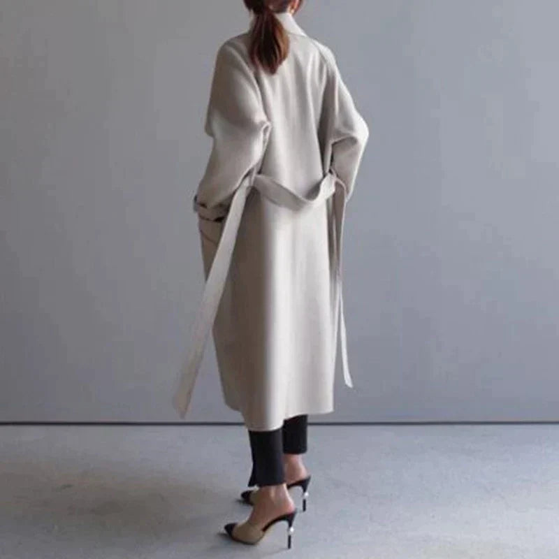 Women's longline button-front coat with notched lapels and side pockets