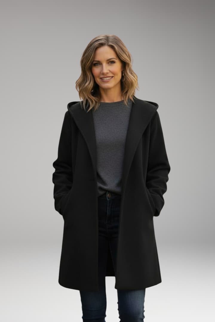 Women's long hooded coat with side pockets and concealed front closure