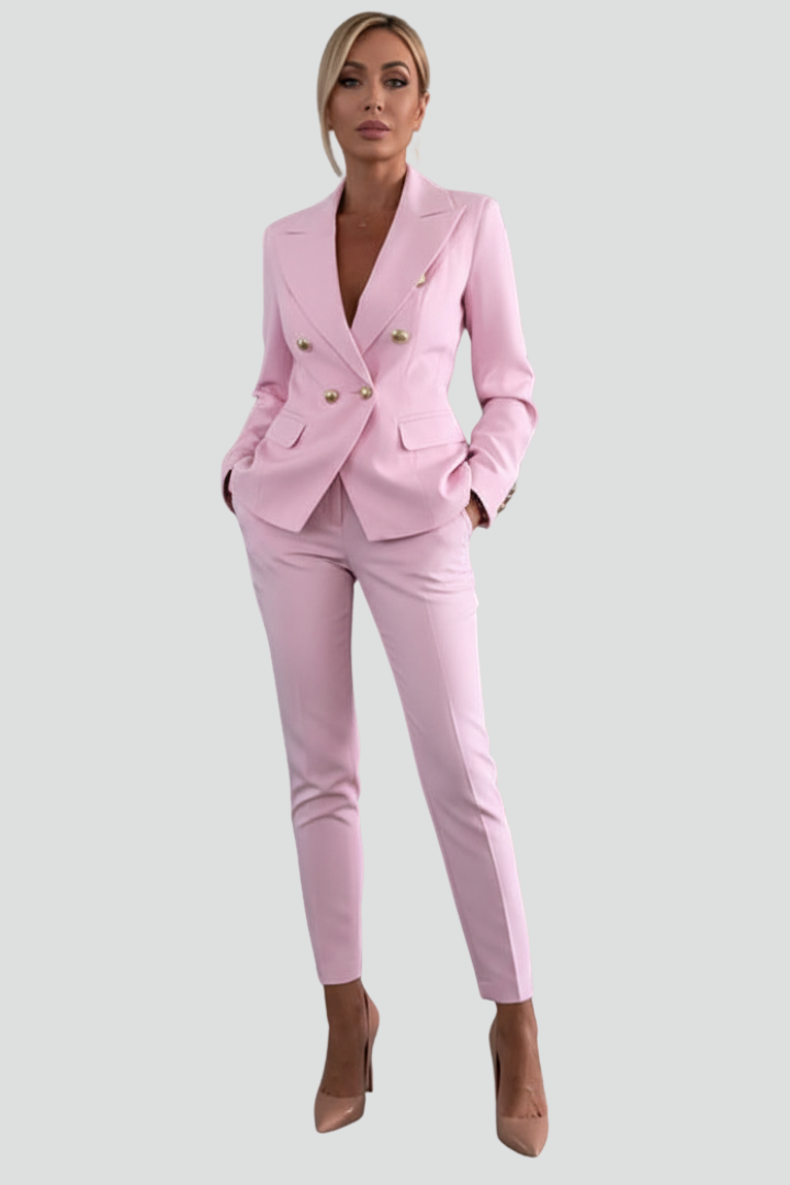 Woman wearing a black double-breasted blazer suit set with straight leg trousers