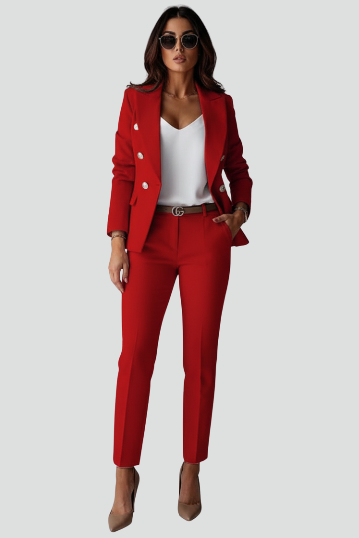 Woman wearing a black double-breasted blazer suit set with straight leg trousers