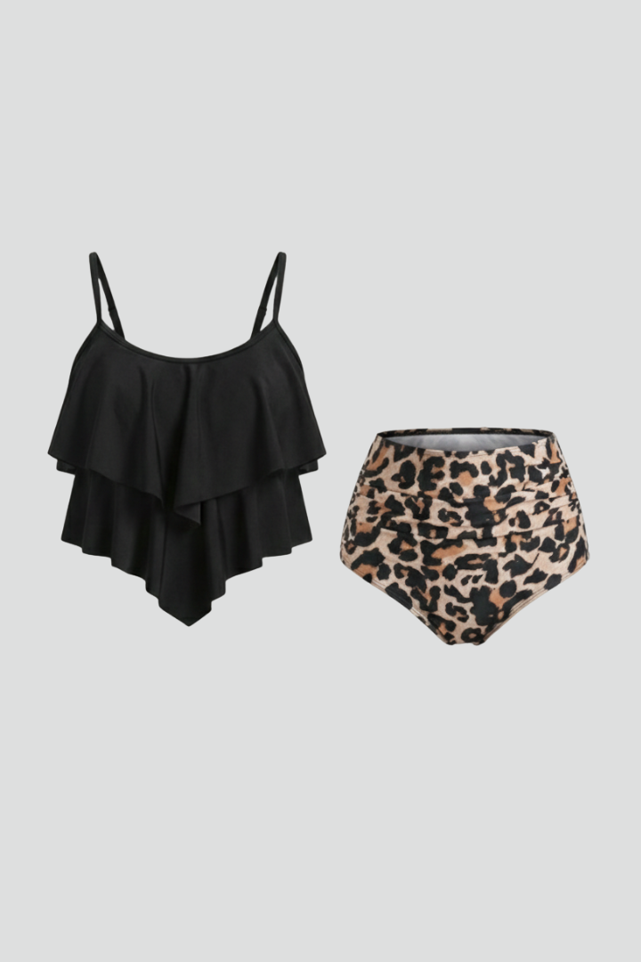 Woman wearing a black ruffle tankini top with high waist leopard print bottom