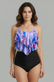 Woman wearing a black ruffle tankini top with high waist leopard print bottom