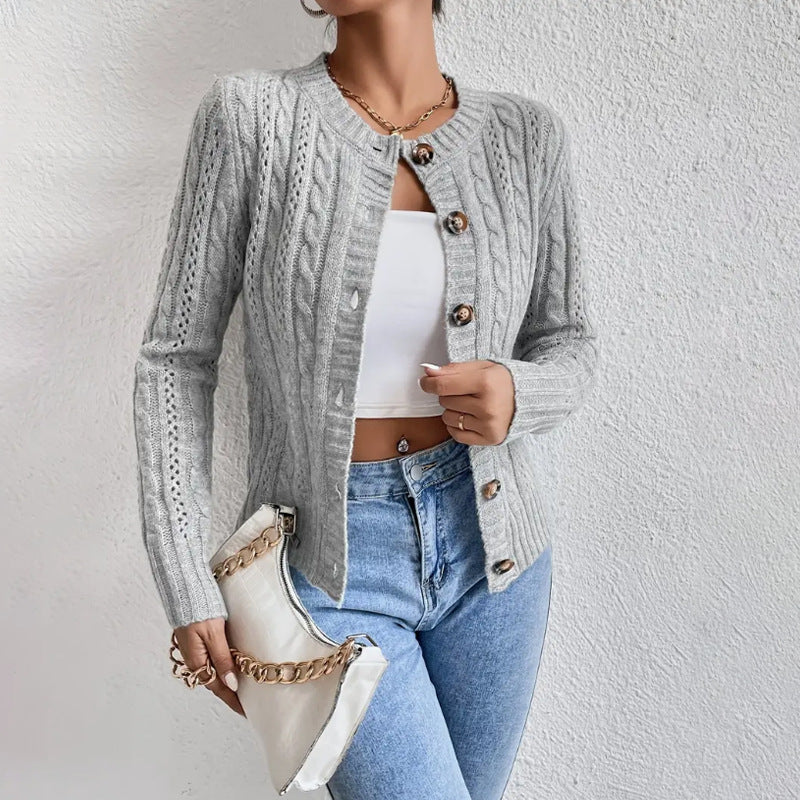 Women's cable knit button front cardigan with long sleeves and crew neckline
