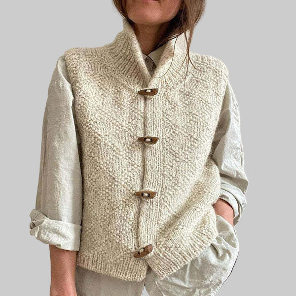 Women's white textured sleeveless cardigan vest with mock neck and button front