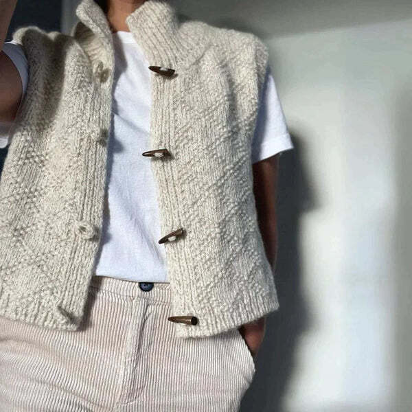 Women's white textured sleeveless cardigan vest with mock neck and button front