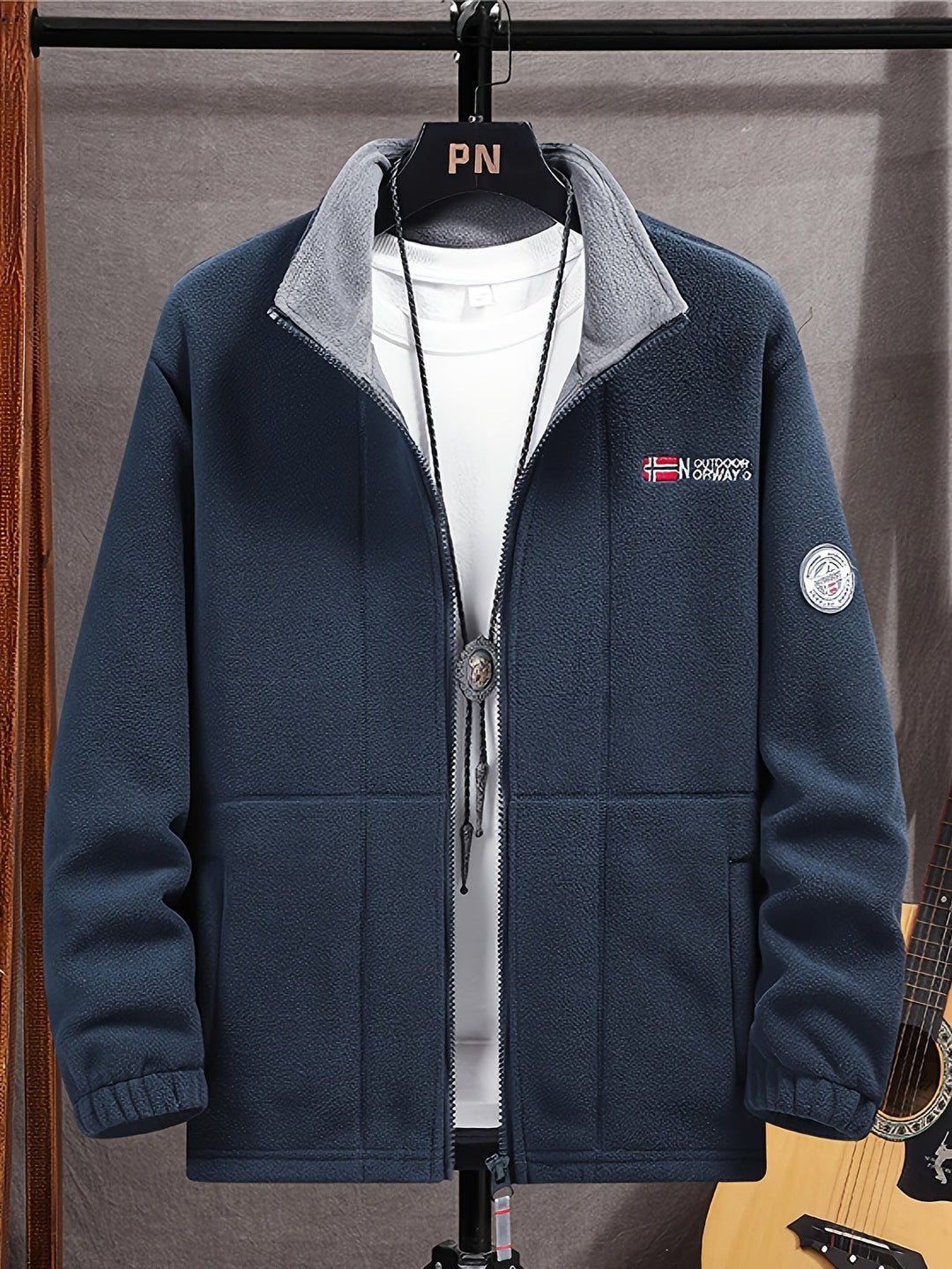 Full-zip fleece jacket with high collar, zipped pockets and elastic cuffs