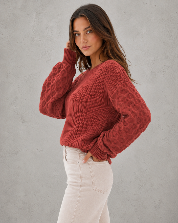 Women's textured knit sweater with lantern sleeves and crew neckline