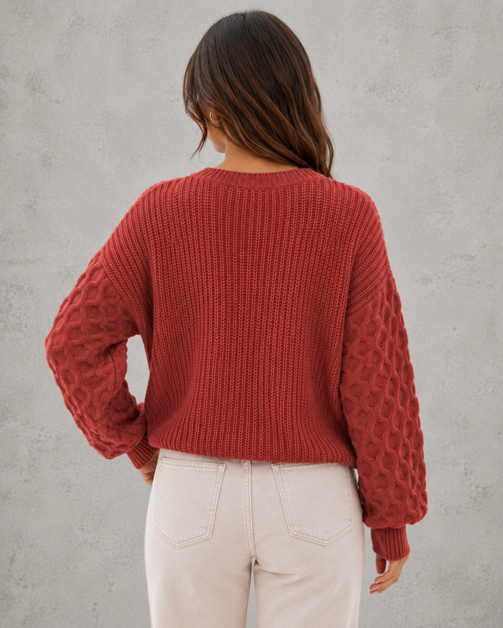 Women's textured knit sweater with lantern sleeves and crew neckline
