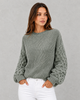 Women's textured knit sweater with lantern sleeves and crew neckline