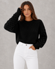 Women's textured knit sweater with lantern sleeves and crew neckline
