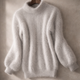 Women's oversized turtleneck sweater with long balloon sleeves and ribbed trims