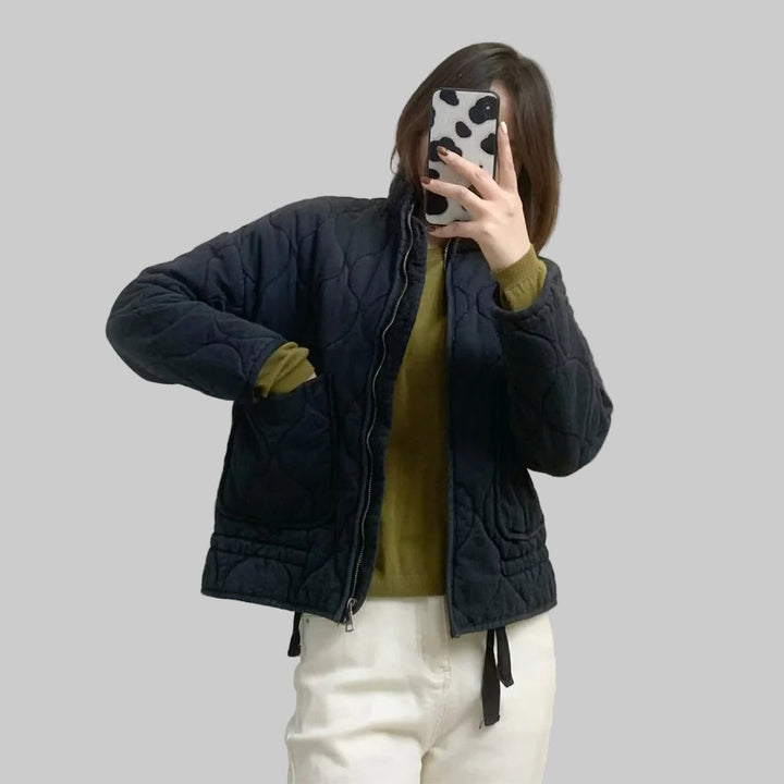 Women's quilted jacket with high collar, front zipper and patch pockets