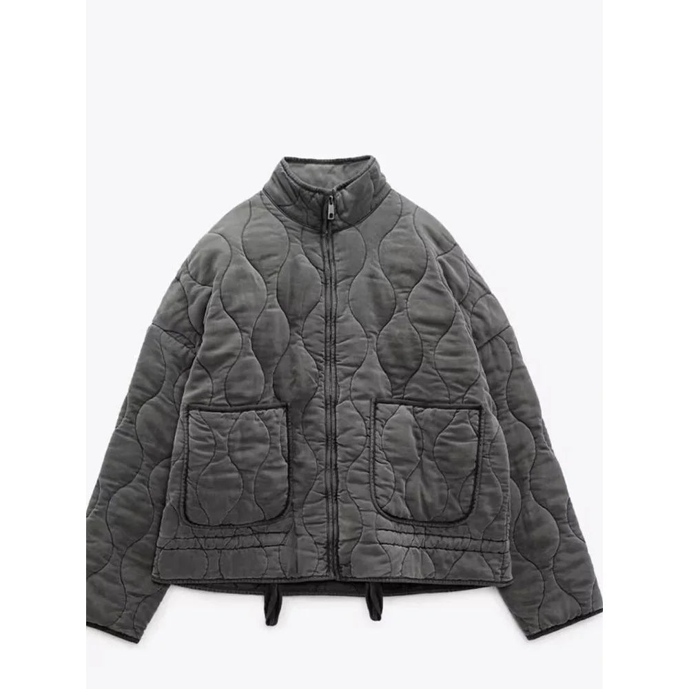 Women's quilted jacket with high collar, front zipper and patch pockets