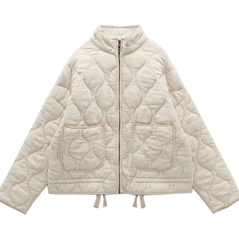 Women's quilted jacket with high collar, front zipper and patch pockets