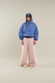 Woman wearing a relaxed hooded sweatshirt with a front pouch pocket