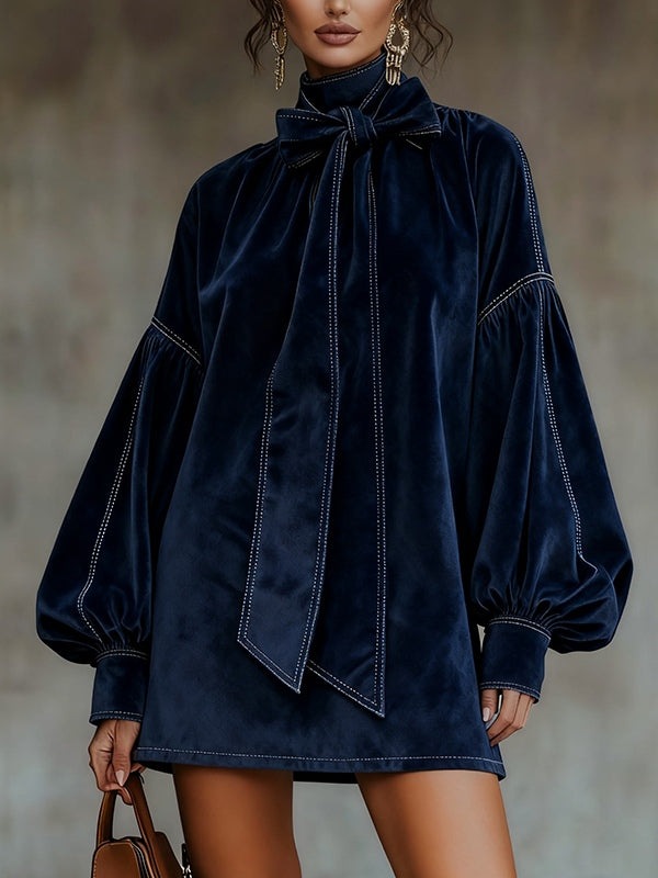 Women's navy velvet mini dress with bow neckline and long balloon sleeves