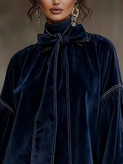 Women's navy velvet mini dress with bow neckline and long balloon sleeves