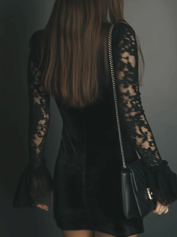 Women's black velvet mini dress with lace V-neckline and long sheer lace sleeves