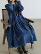 Women's long sleeve maxi dress with a round neckline and gathered full skirt
