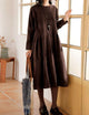 Women's long sleeve maxi dress with a round neckline and gathered full skirt