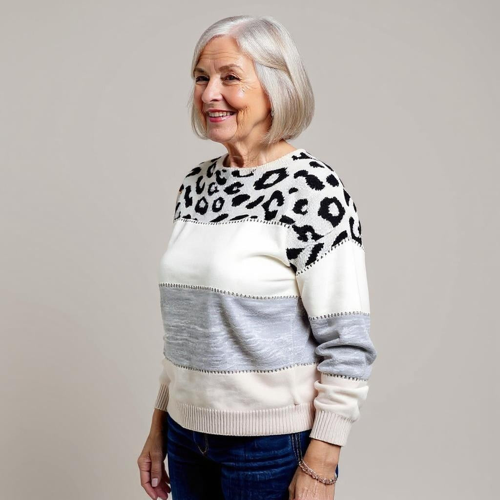 Women's leopard print color block sweater with crew neckline and long sleeves