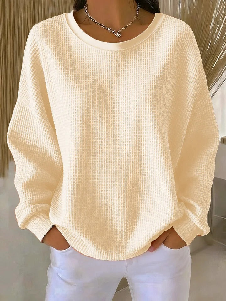 Women's textured crew neck sweater with long sleeves and ribbed cuffs