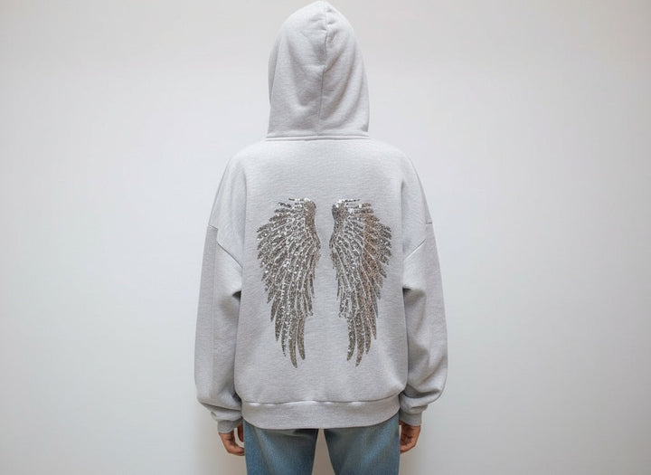 Grey hooded sweatshirt with sequin wings on the back