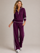Women's zip sweater and wide-leg trouser set with contrast striped trims