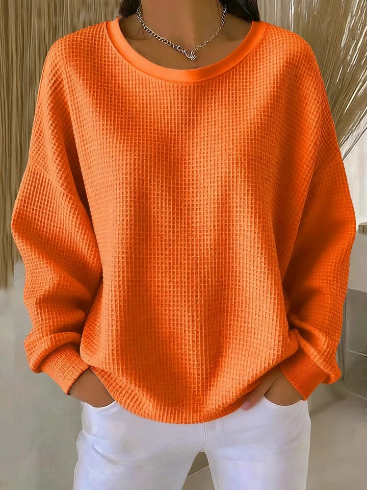 Women's textured crew neck sweater with long sleeves and ribbed cuffs
