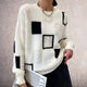 Women's patchwork crew-neck sweater with contrasting geometric panels