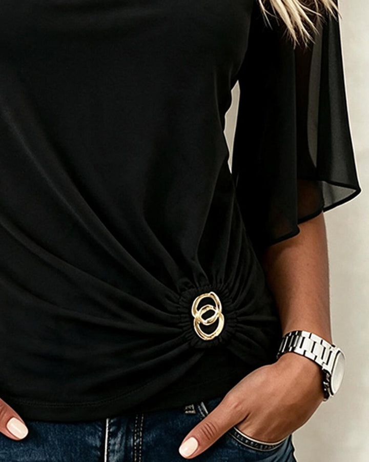 Women's black blouse with sheer 3/4 sleeves and gathered gold-tone ring waist detail