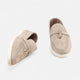 Men's textured slip-on loafers with flat soles, stitched apron detail and decorative toggle trim